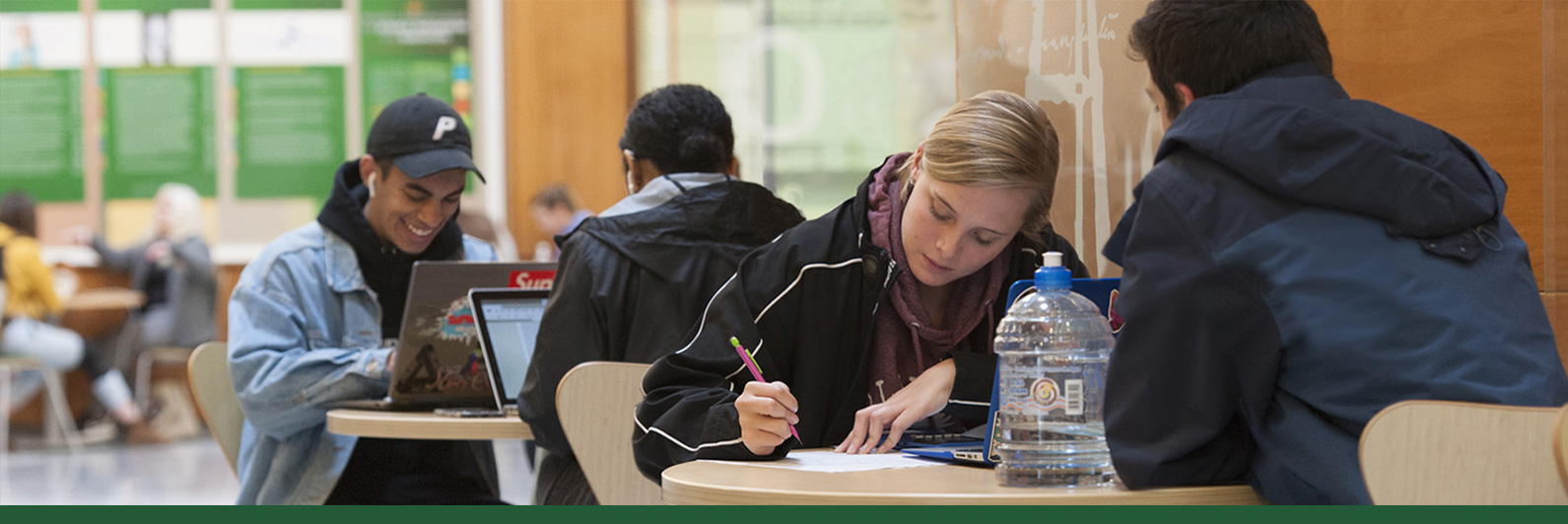 Students study in the Nucleus, on the first floor of the Shineman Center